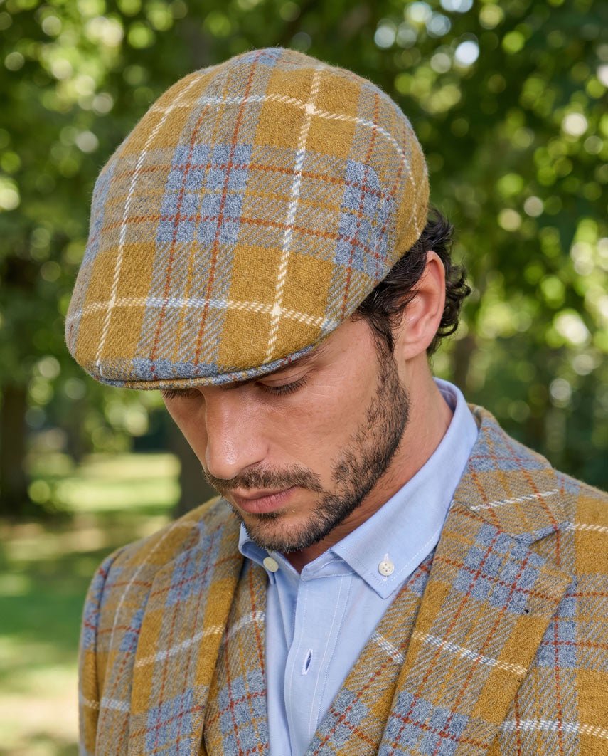 Schiebermütze "Henry Cap" aus original Harris Tweed in amber check - Wellington of Bilmore
