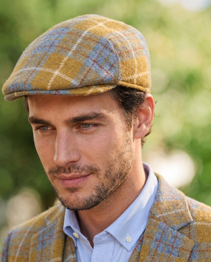 Schiebermütze "Henry Cap" aus original Harris Tweed in amber check - Wellington of Bilmore